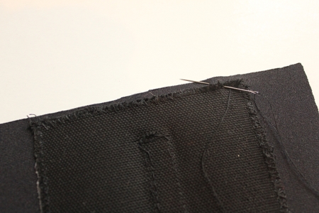 stitching of fabric to the back